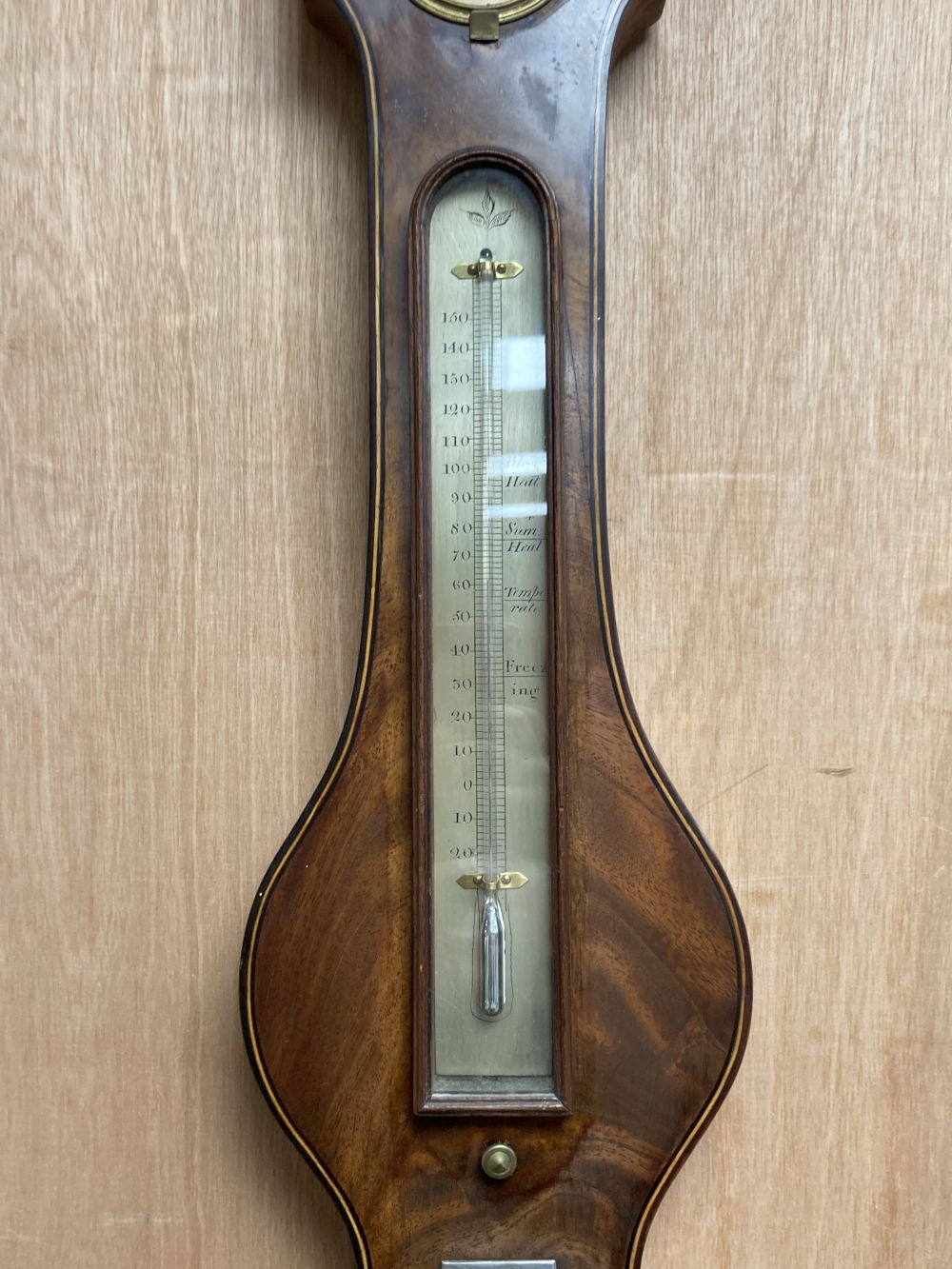 An early 19th century mahogany wheel barometer, marked Pastorelli, height 120cm